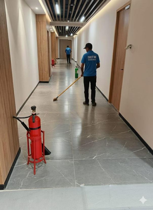 IWFM staff mopping an office hallway